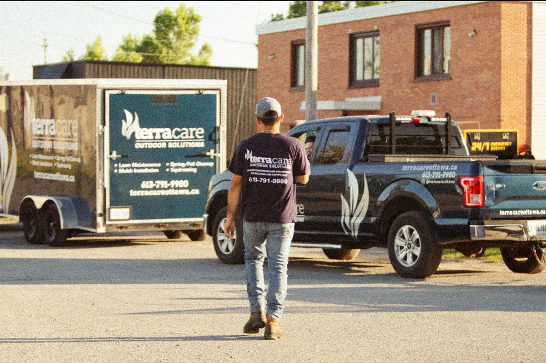 TerraCare branded truck and trailer with a crew member on site in Ottawa